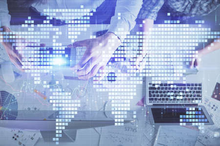 Double exposure of man and woman working together and business theme hologram drawing. Computer...