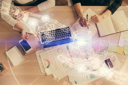 Double exposure of woman hands working on computer and data theme hologram drawing. Top View. Technology concept.の写真素材