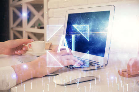 Double exposure of woman hands working on computer and data theme hologram drawing. Tech concept.