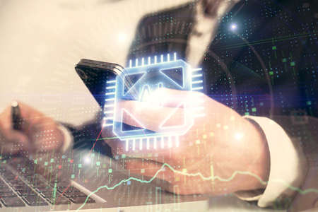 Multi exposure of man's hand holding and using a digital device and data theme drawing. Innovation...