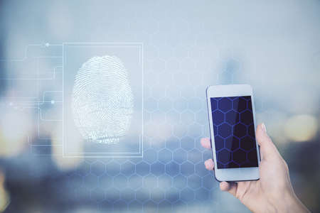 Double exposure of fingerprint hologram and woman holding and using a mobile device. Security...