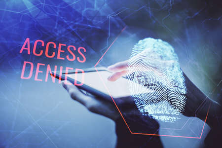 Double exposure of fingerprint hologram and woman holding and using a mobile device. Security...