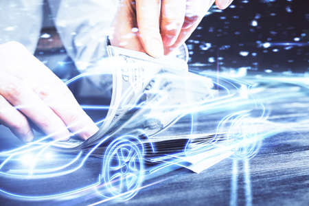 Multi exposure of Tech taxi drawing hologram and USA dollars bills and man hands. Technology...