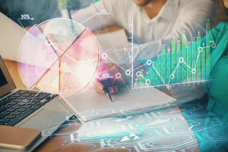 Double exposure of forex chart drawing over people taking notes background. Concept of financial...