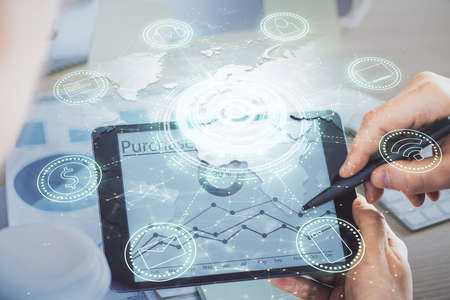 Double exposure of man's hands holding and using a phone and social network theme drawing.