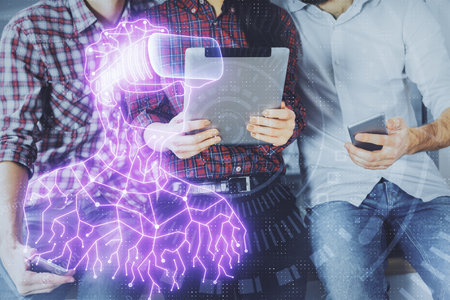 Double exposure of human hologram in VR glasses drawing and man and woman working together holding and using a mobile device. Education conceptの写真素材