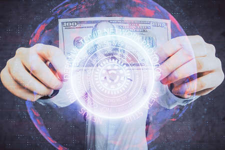Multi exposure of Tech drawing hologram and USA dollars bills and man hands. Technology concept.の写真素材
