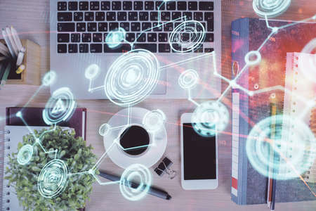 Double exposure of social network theme drawing over table with phone. Top view. People connecting concept.の写真素材