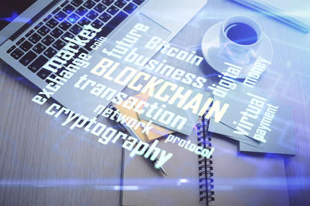Blockchain theme hologram drawings over computer on the desktop background. Top view. Double exposure.の写真素材