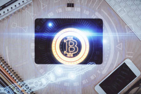 Double exposure of blockchain theme hologram over table with phone. Top view. Crypto technology concept.の写真素材