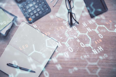 Double exposure of tech formula drawing and work table top veiw. concept of education.の写真素材