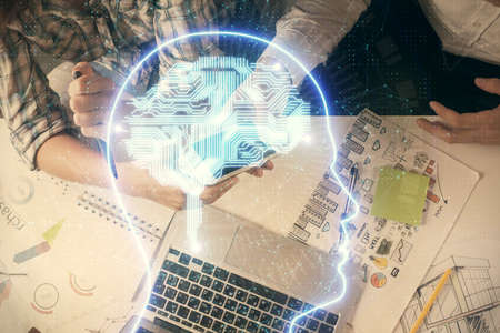 Double exposure of man and woman working together holding and using a mobile device and brain...