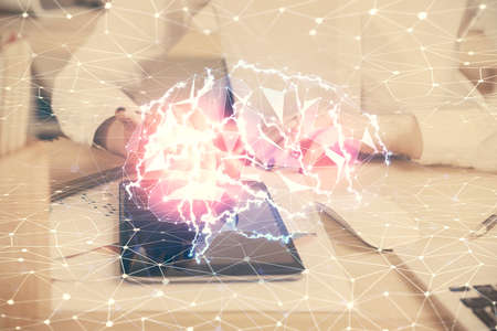 Double exposure of brain sketch hologram and woman holding and using a mobile device.