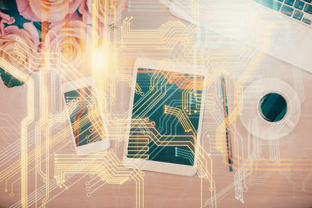 Double exposure of map hologram drawing over desktop. Top view. International connection concept.の写真素材