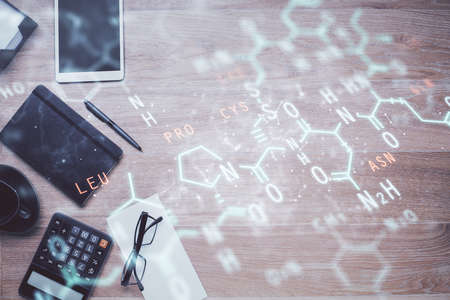 Double exposure of tech formula drawing and work table top veiw. concept of education.の写真素材