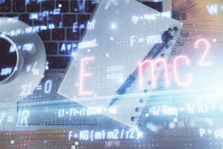 Double exposure of tech formula drawing and work table top veiw. concept of education.の写真素材