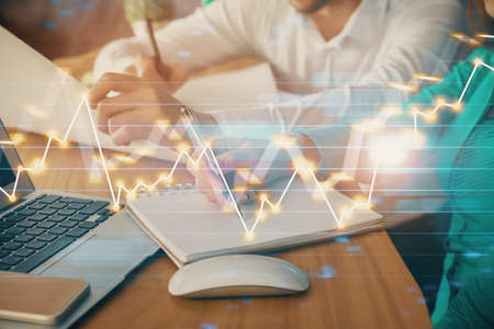 Double exposure of forex chart drawing over people taking notes background. Concept of financial...