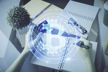 Multi exposure of woman on-line shopping holding a credit card and crypto theme drawing. Blockchain E-commerce concept.の写真素材
