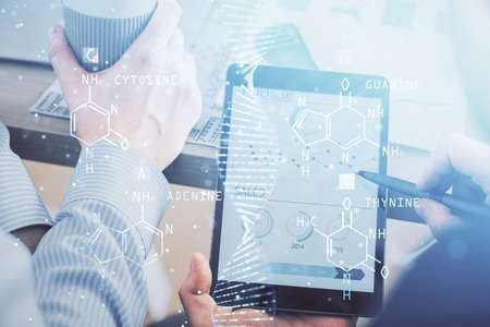 Double exposure of man's hands holding and using a phone and DNA drawing. Medical education concept.
