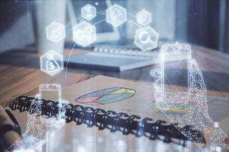 Double exposure of tech drawing and desk with open notebook background. Concept of technology