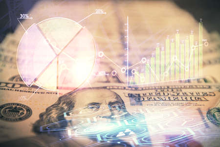 Double exposure of forex graph drawing over us dollars bill background. Concept of financial...