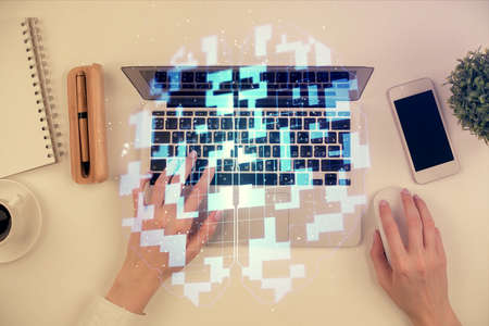 Double exposure of woman hands working on computer and data theme hologram drawing. Top View. Technology concept.の写真素材