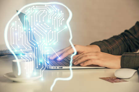 Multi exposure of woman hands working on computer and human brain hologram drawing. Ai tech concept.の写真素材