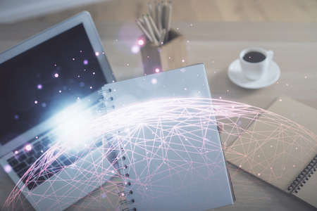 Double exposure of woman hands typing on computer and social network theme hologram drawing. People media concept.の写真素材