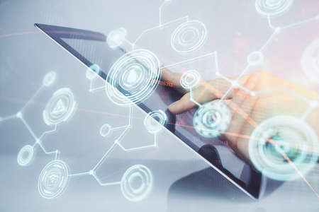 Double exposure of man's hands holding and using a phone and social network theme drawing.