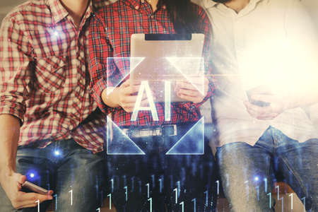 Double exposure of data theme hologram drawing and man and woman working together holding and using a mobile device.の写真素材