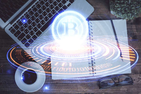 Blockchain theme hologram drawings over computer on the desktop background. Top view. Double exposure.の写真素材