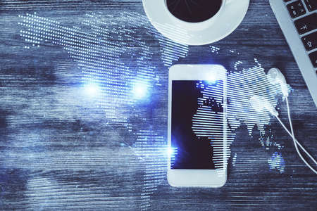 Double exposure of social network theme drawing over table with phone. Top view. People connecting...
