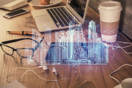 Double exposure of town sketch over cell phone background. Concept of smart city