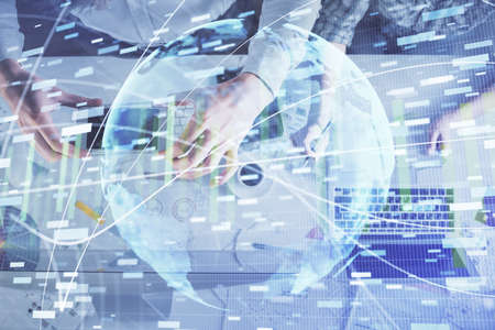 Double exposure of man and woman working together and business theme hologram drawing. Computer...