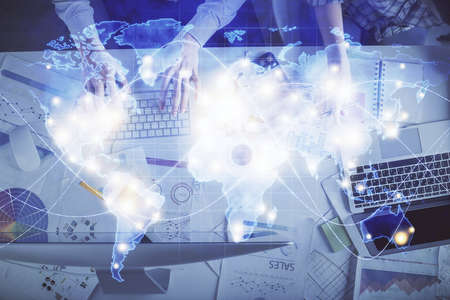 Double exposure of man and woman working together and business theme hologram drawing. Computer...