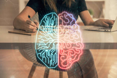 Multi exposure of woman hands working on computer and human brain hologram drawing. Ai tech concept.の写真素材