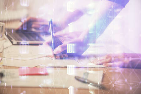 Double exposure of woman hands working on computer and data theme hologram drawing. Tech concept.