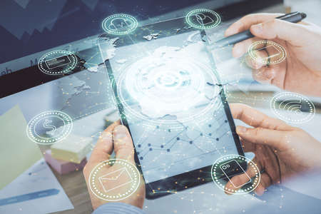 Double exposure of man's hands holding and using a phone and social network theme drawing.