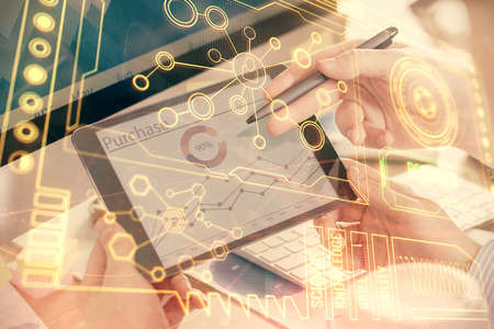 Multi exposure of man's hands holding and using a digital device and data theme drawing. Innovation...