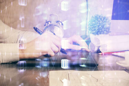 Multi exposure of man's hands holding and using a digital device and data theme drawing. Innovation concept.の写真素材