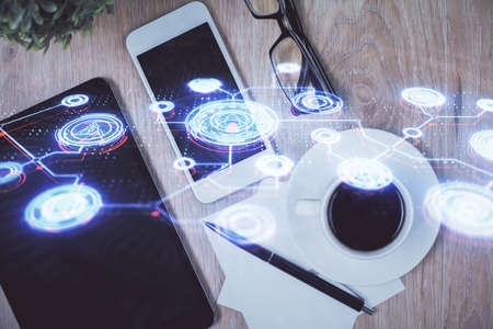 Double exposure of social network theme drawing over table with phone. Top view. People connecting...