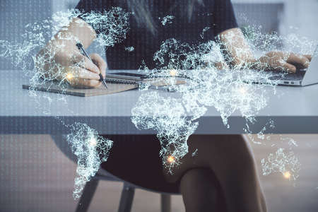 Double exposure of woman hands typing on computer and social network theme hologram drawing. People media concept.の写真素材