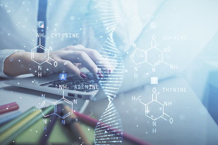Double exposure of woman hands typing on computer and DNA hologram drawing. Medical education concept.の写真素材