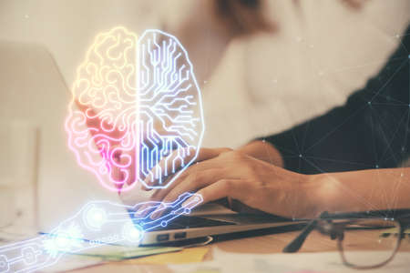 Multi exposure of woman hands working on computer and brain hologram drawing. Ai concept.