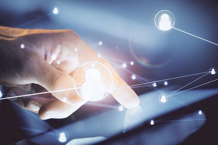 Double exposure of man's hands holding and using a phone and social network theme drawing.