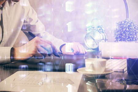 Multi exposure of man's hands holding and using a digital device and data theme drawing. Innovation...