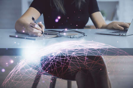 Double exposure of woman hands typing on computer and social network theme hologram drawing. People media concept.の写真素材