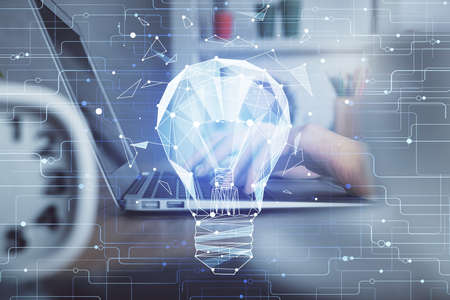 Double exposure of woman hands typing on computer and light bulb drawing. Idea concept.