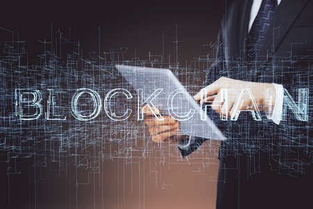 Double exposure of man's hands holding and using a phone and crypto currency blockchain theme drawing.の写真素材