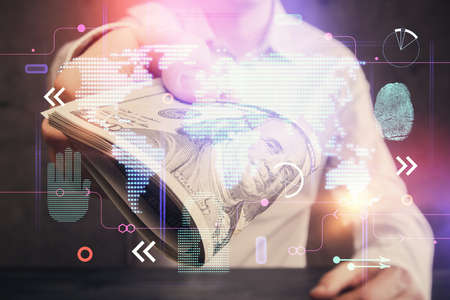 Double exposure of world map drawing hologram and us dollars bills and man hands.の写真素材